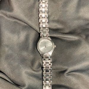 Elegant stainless steal watch w/ crystals on the band.